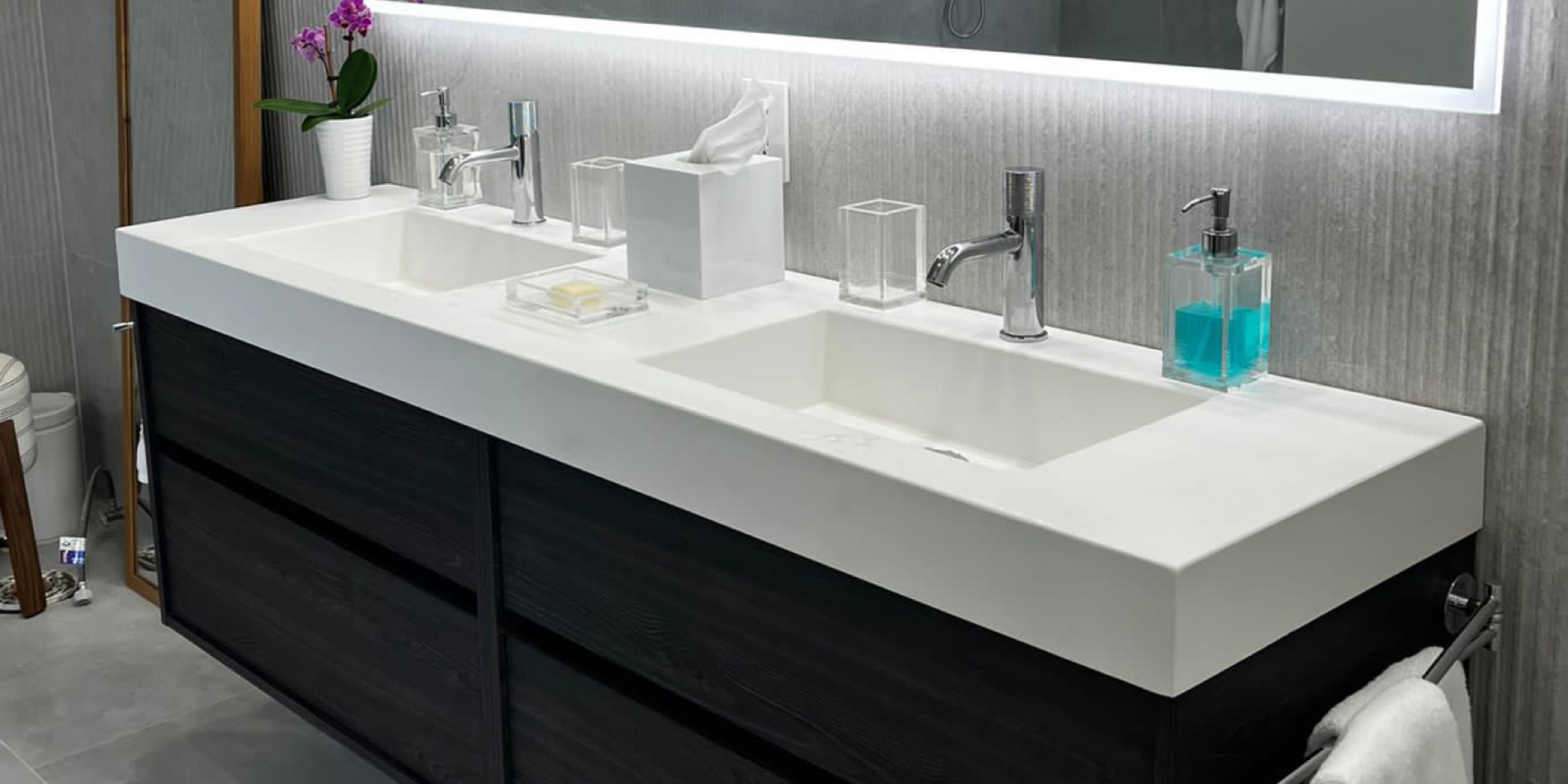 Custom cultured marble double vanity top in a modern bathroom
